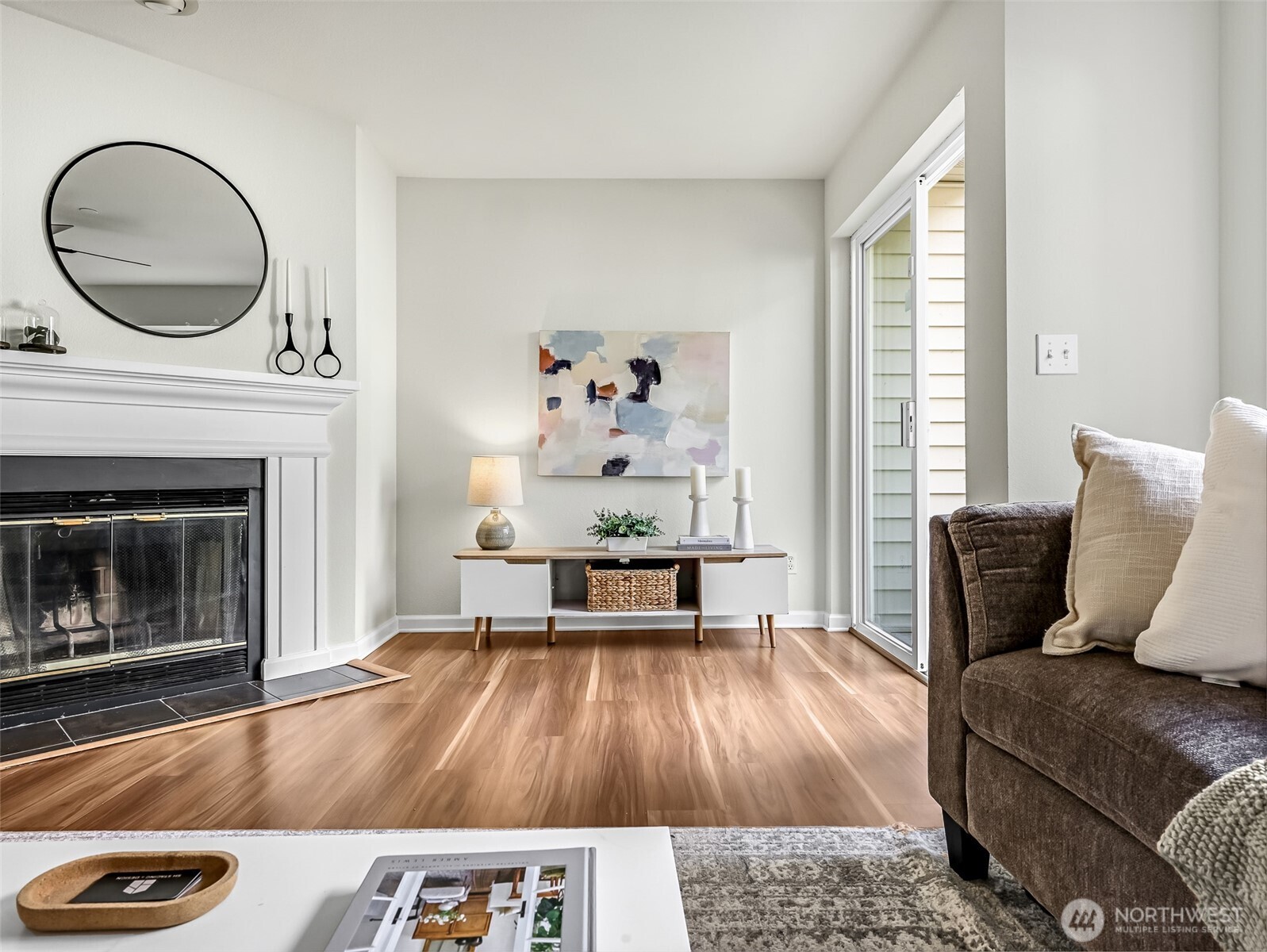 2300 Jefferson Avenue Northeast, Unit I137 Renton, WA 98056 - Photo 6 of 40 a living room with furniture and a fireplace