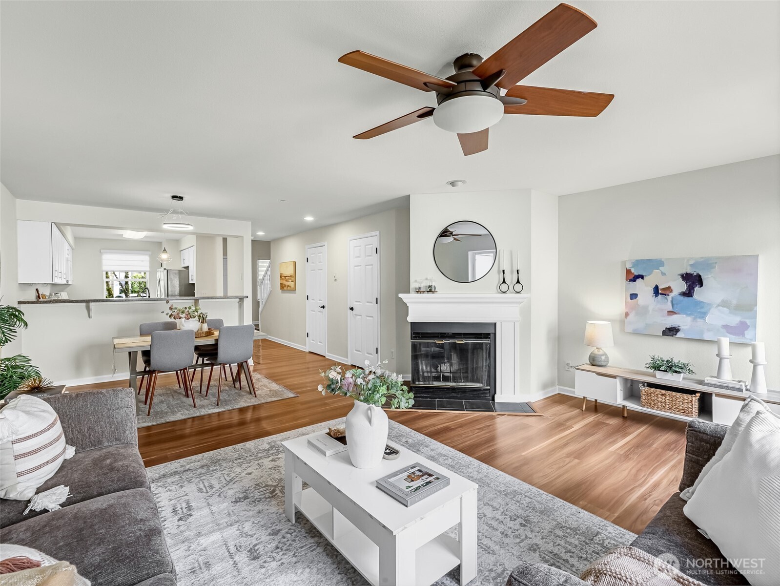 2300 Jefferson Avenue Northeast, Unit I137 Renton, WA 98056 - Photo 8 of 40 a living room with furniture and a fireplace