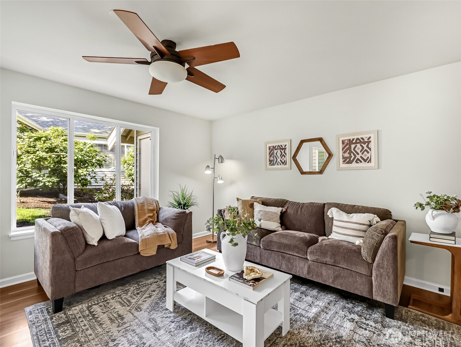 2300 Jefferson Avenue Northeast, Unit I137 Renton, WA 98056 - Photo 9 of 40 a living room with furniture and a large window