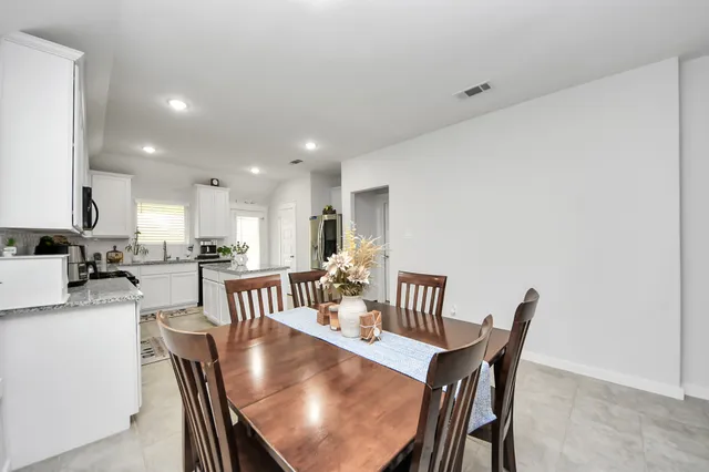 a view of a dining room with furniture