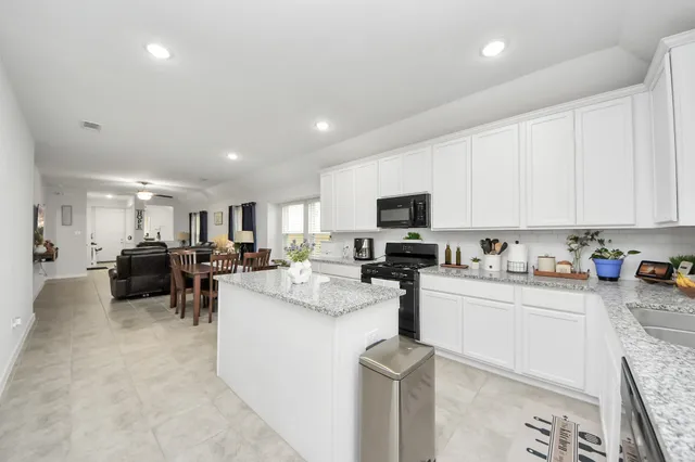 a kitchen with sink cabinets and counter top space