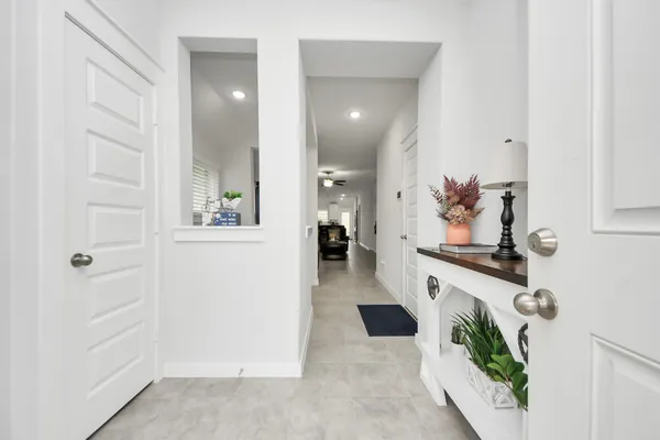 a view of living room with furniture and a mirror