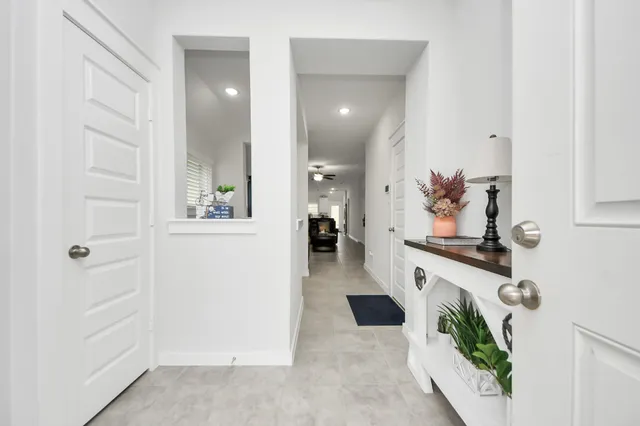 a view of living room with furniture and a mirror