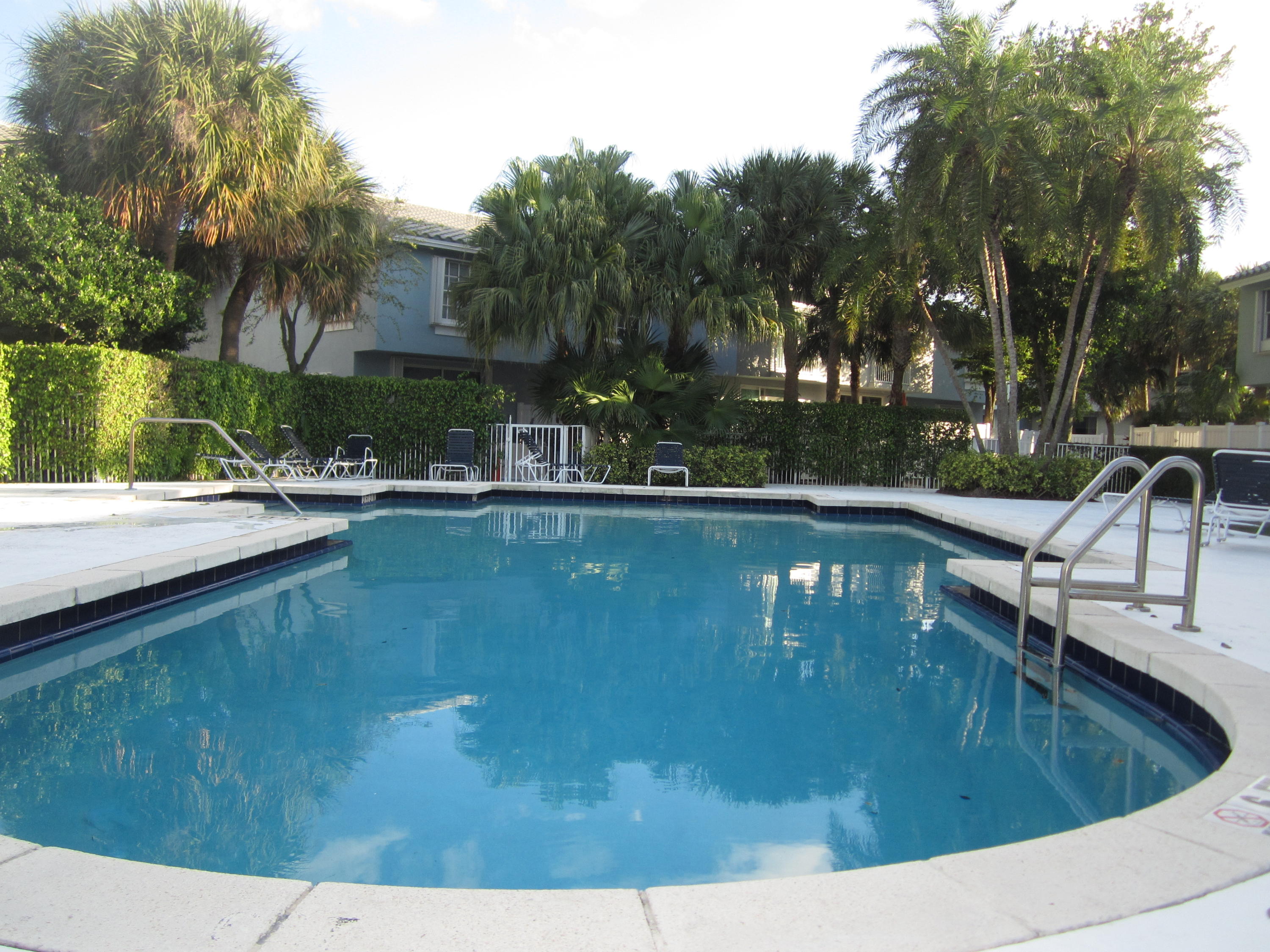 1094 Jeffery Street Boca Raton, FL 33487 - Photo 1 of 1 a view of a swimming pool with a patio