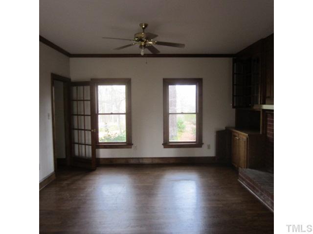 39 Dawn Road Benson, NC 27504 - Photo 4 of 11 a view of an empty room with a window and wooden floor