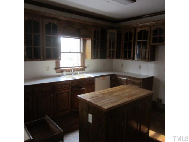 39 Dawn Road Benson, NC 27504 - Photo 5 of 11 a kitchen with a sink cabinets and window