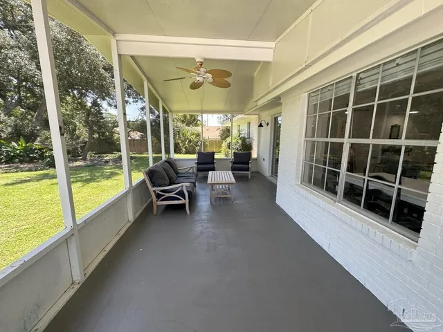a view of a porch with furniture