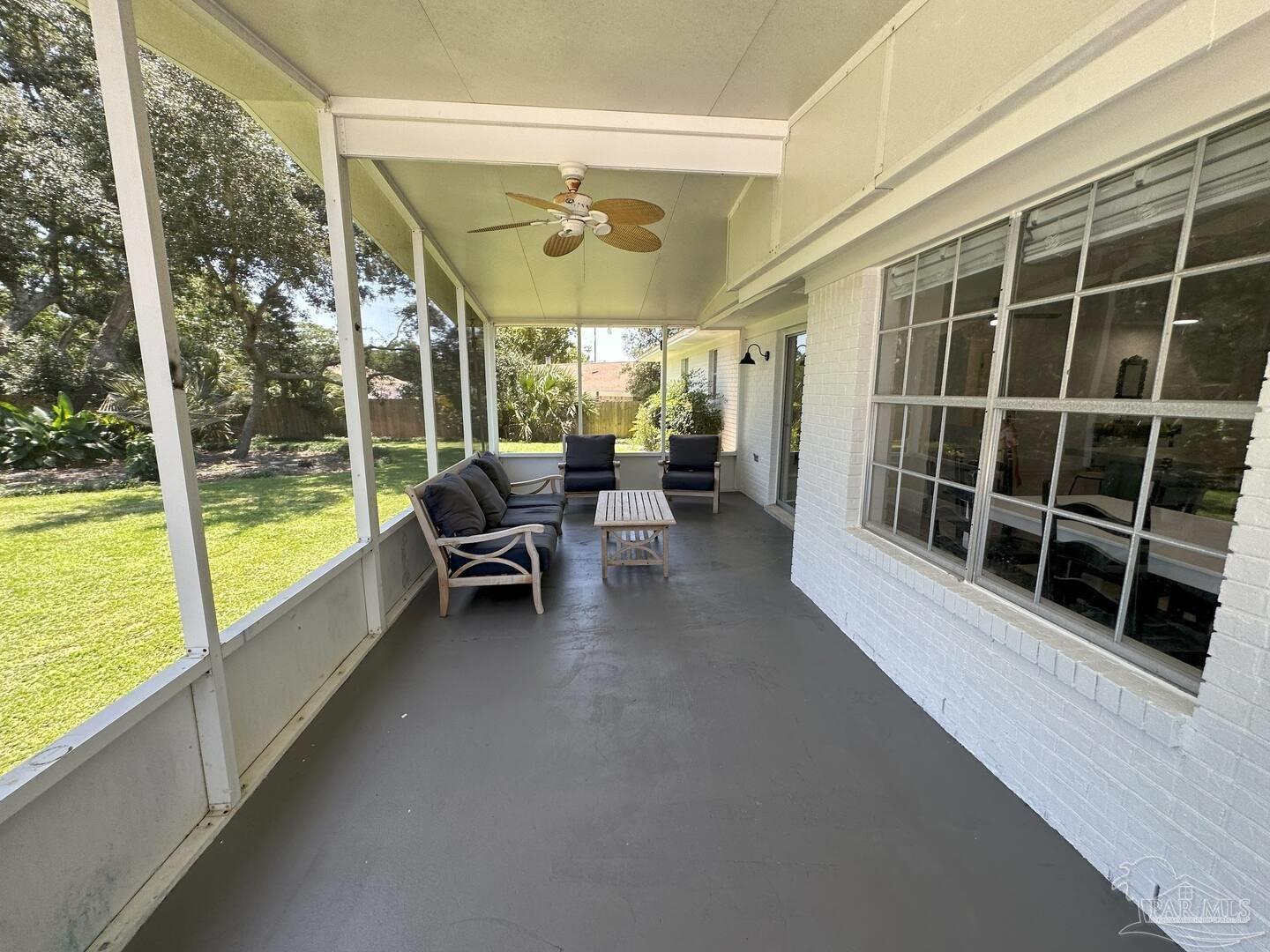 1406 Rancho Villa Drive Gulf Breeze, FL 32563 - Photo 15 of 19 a view of a porch with furniture
