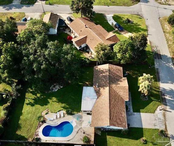 an aerial view of a house with outdoor space