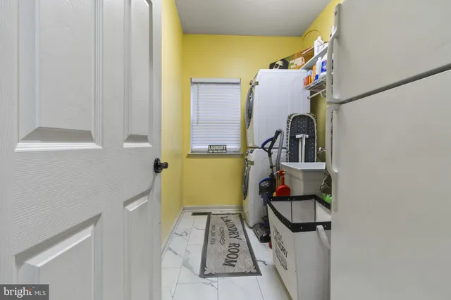 walk in closet with wooden floor