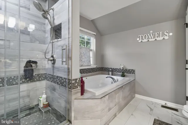 a bath tub sitting next to a bathroom