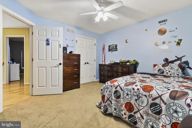 a bedroom with a bed and a dresser