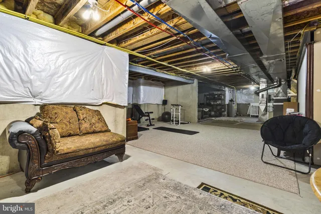 a view of living room with furniture and a couch