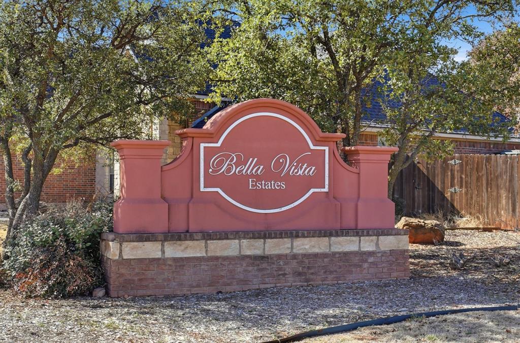 4225 Sierra Sunset Abilene, TX 79606 - Photo 2 of 8 a sign that is sitting on a brick wall