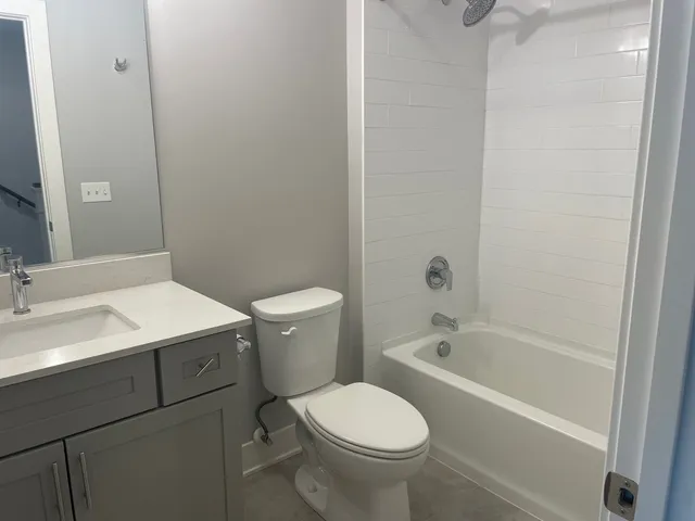 a bathroom with a sink toilet and bathtub