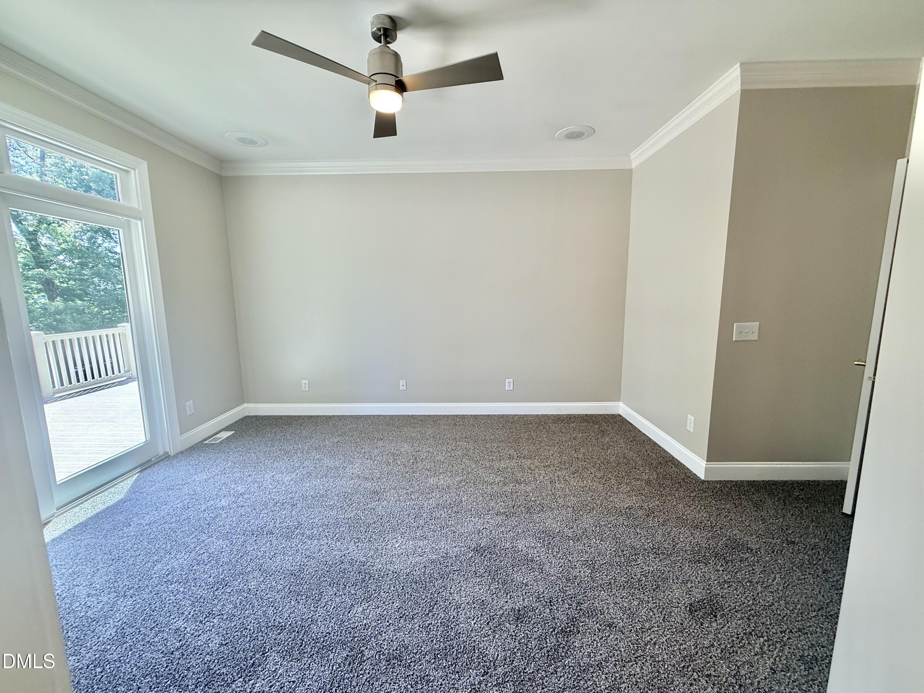81 Beaver Crossing Road Roxboro, NC 27574 - Photo 26 of 80 an empty room with a empty space and a ceiling fan
