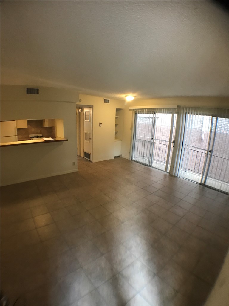 2610 Salado Street, Unit 105 Austin, TX 78705 - Photo 3 of 11 a view of empty room with wooden floor