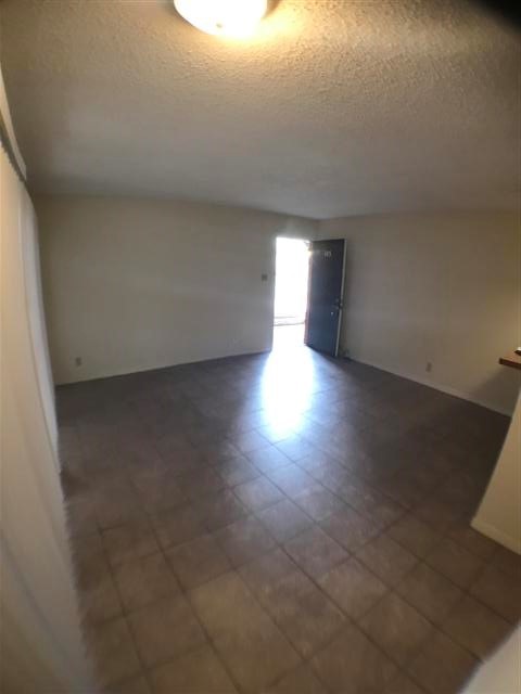 2610 Salado Street, Unit 105 Austin, TX 78705 - Photo 5 of 11 a view of a livingroom with wooden floor and a window