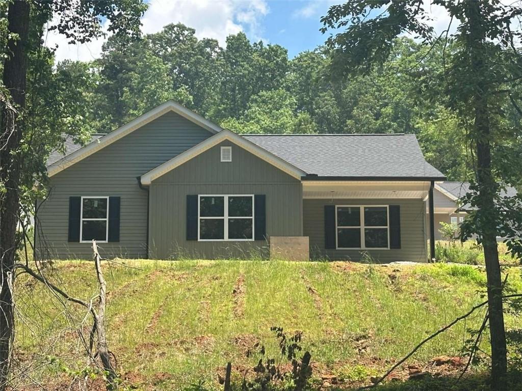 60 Reeves And Norrell Road Dawsonville, GA 30534 - Photo 1 of 11 a house with trees in the background