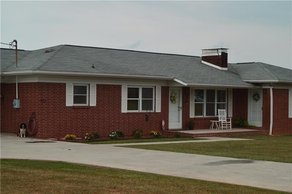 750 Sharpe Mill Road Hiddenite, NC 28636 - Photo 3 of 11 a front view of a house with a yard