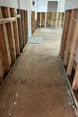 a view of an empty room with windows