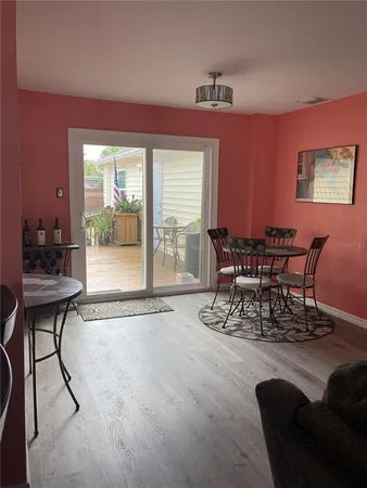 an empty room with windows and closet area