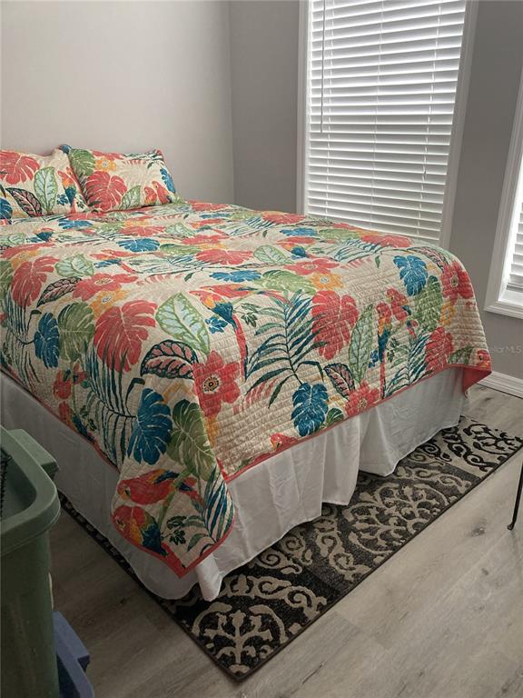 14033 Palm Street Madeira Beach, FL 33708 - Photo 30 of 41 a bedroom with a bed and a window