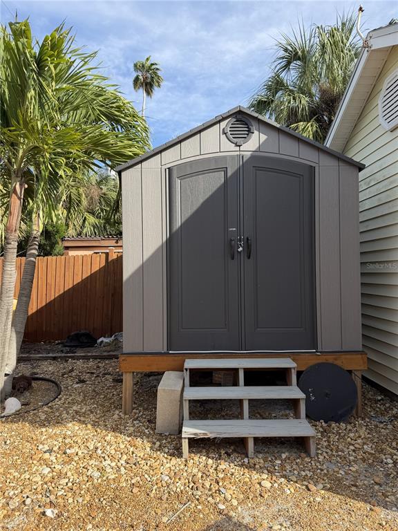 14033 Palm Street Madeira Beach, FL 33708 - Photo 39 of 41 a house with a trees in the background