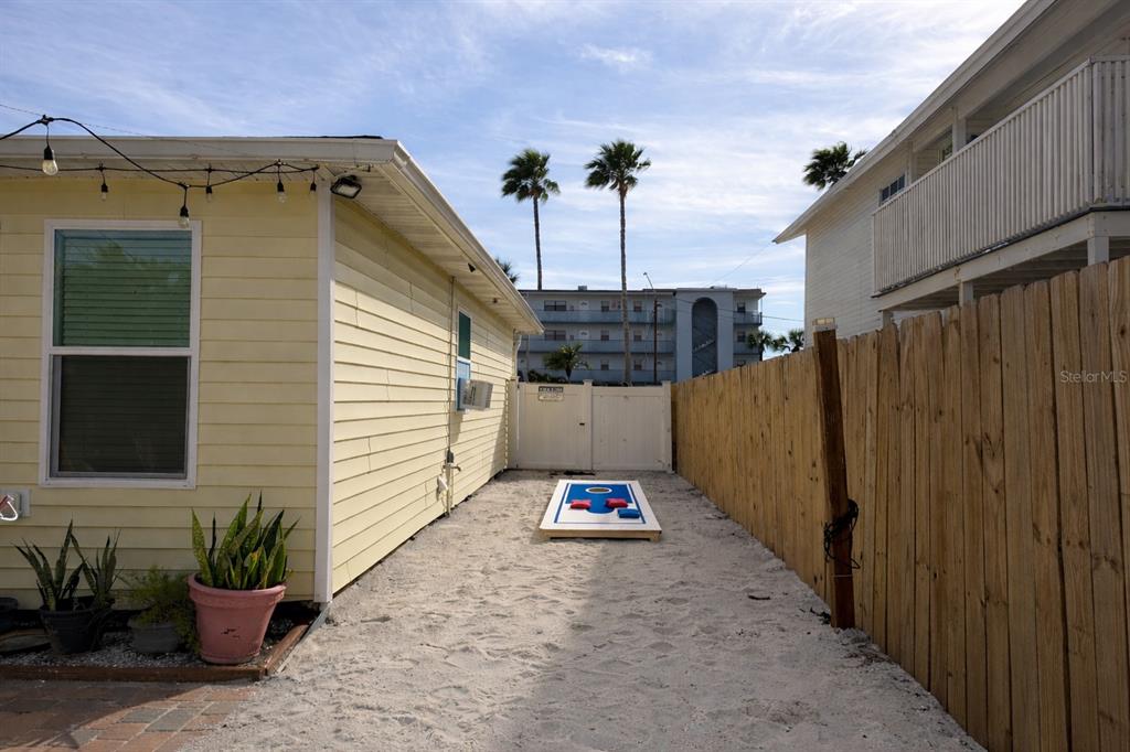 14033 Palm Street Madeira Beach, FL 33708 - Photo 41 of 41 a backyard of a house with potted plants