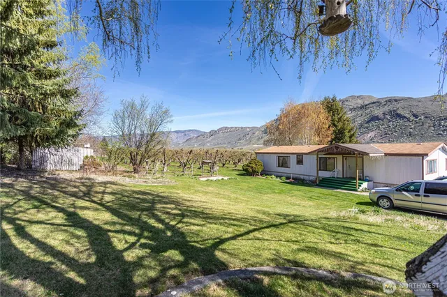 a view of a house with a big yard