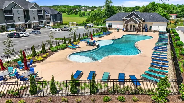 a front view of multiple houses with yard