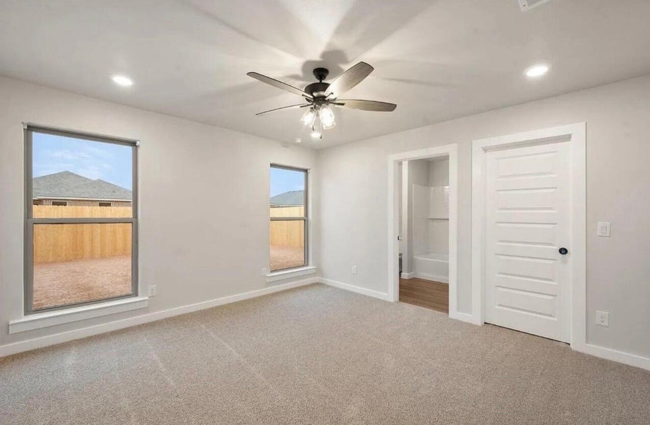 1708 145th Street Lubbock, TX 79423 - Photo 13 of 19 a view of an empty room with a window