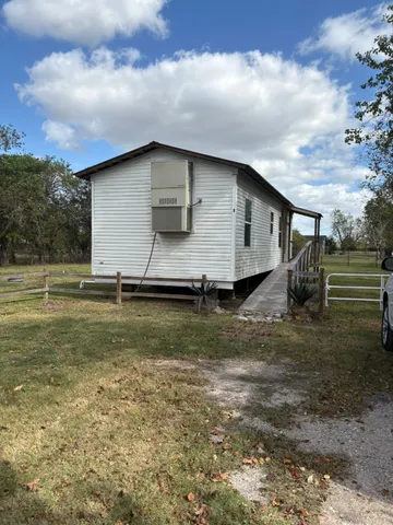 a view of backyard with green space