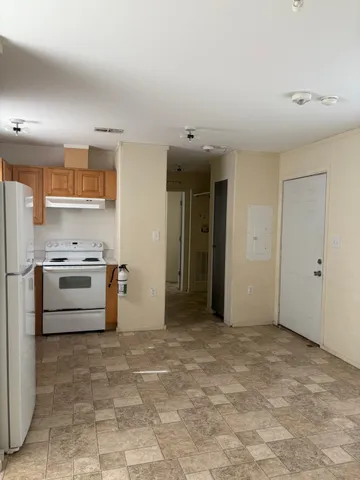 a view of a kitchen with microwave and stove