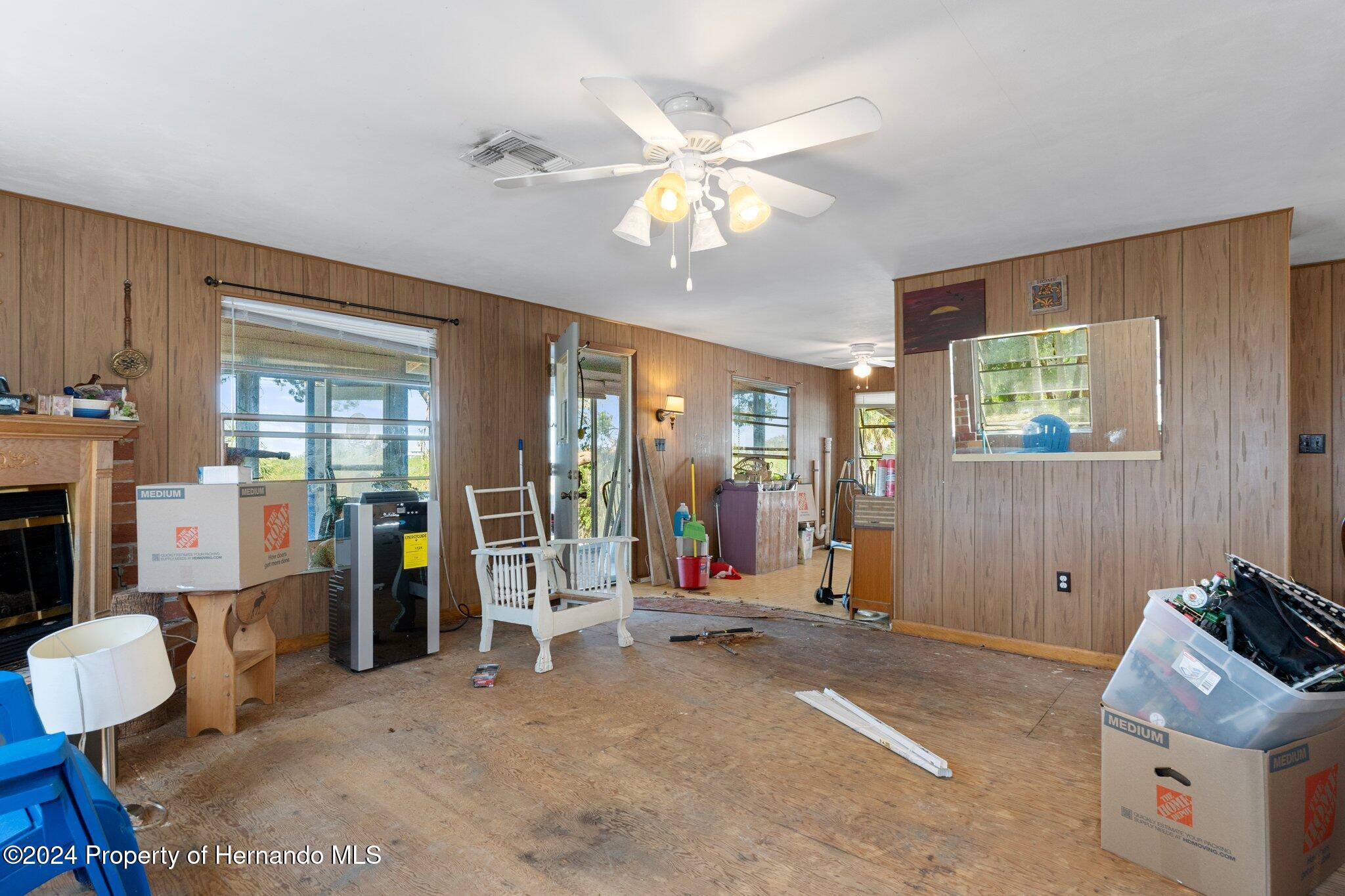 8122 Camp Lane Aripeka, FL 34679 - Photo 26 of 40 a living room with furniture and a window