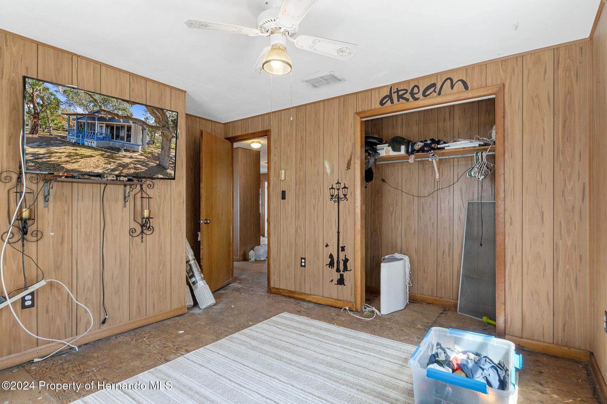 8122 Camp Lane Aripeka, FL 34679 - Photo 34 of 40 a view of a hallway with wooden floor and entryway