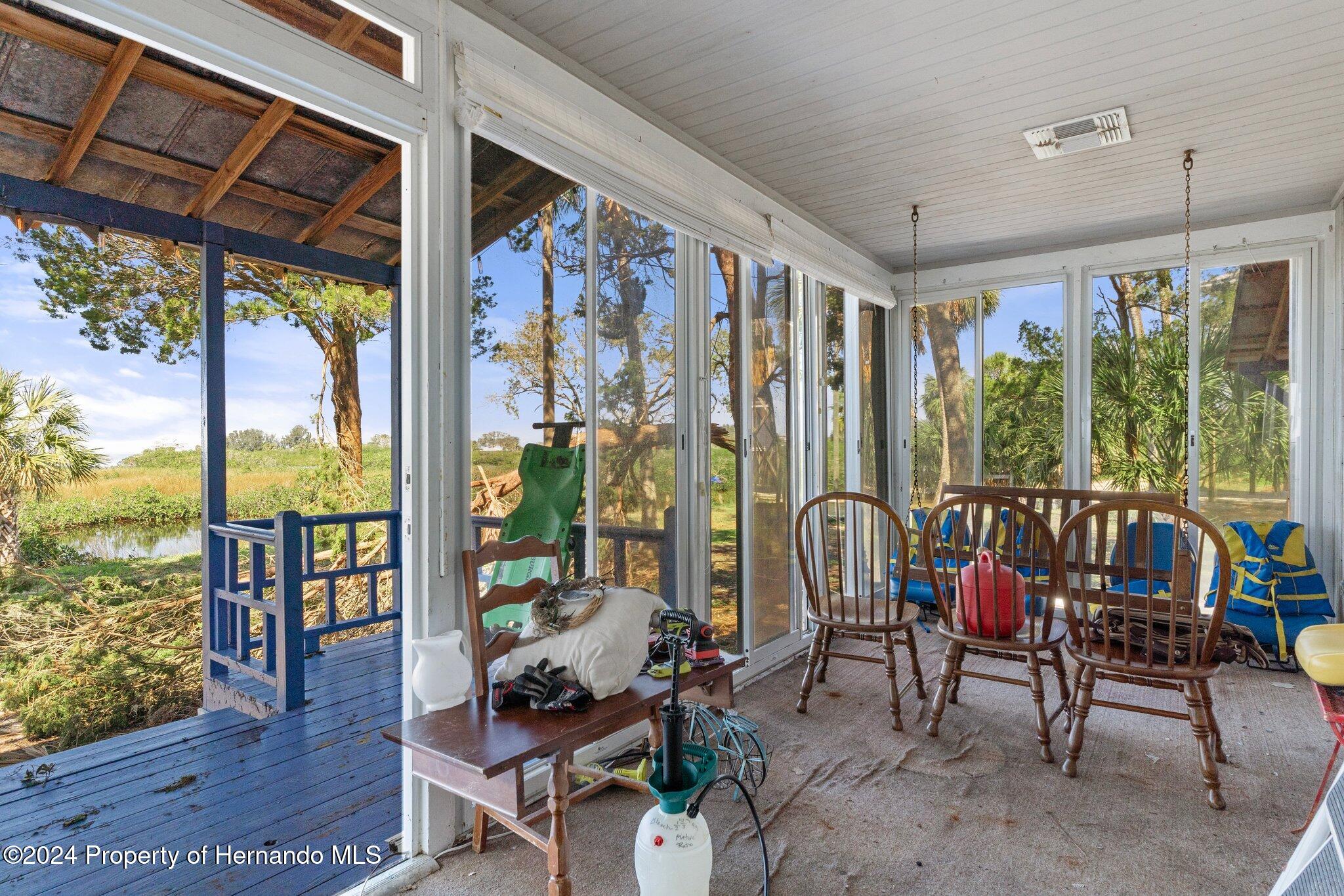 8122 Camp Lane Aripeka, FL 34679 - Photo 36 of 40 a living room with large windows