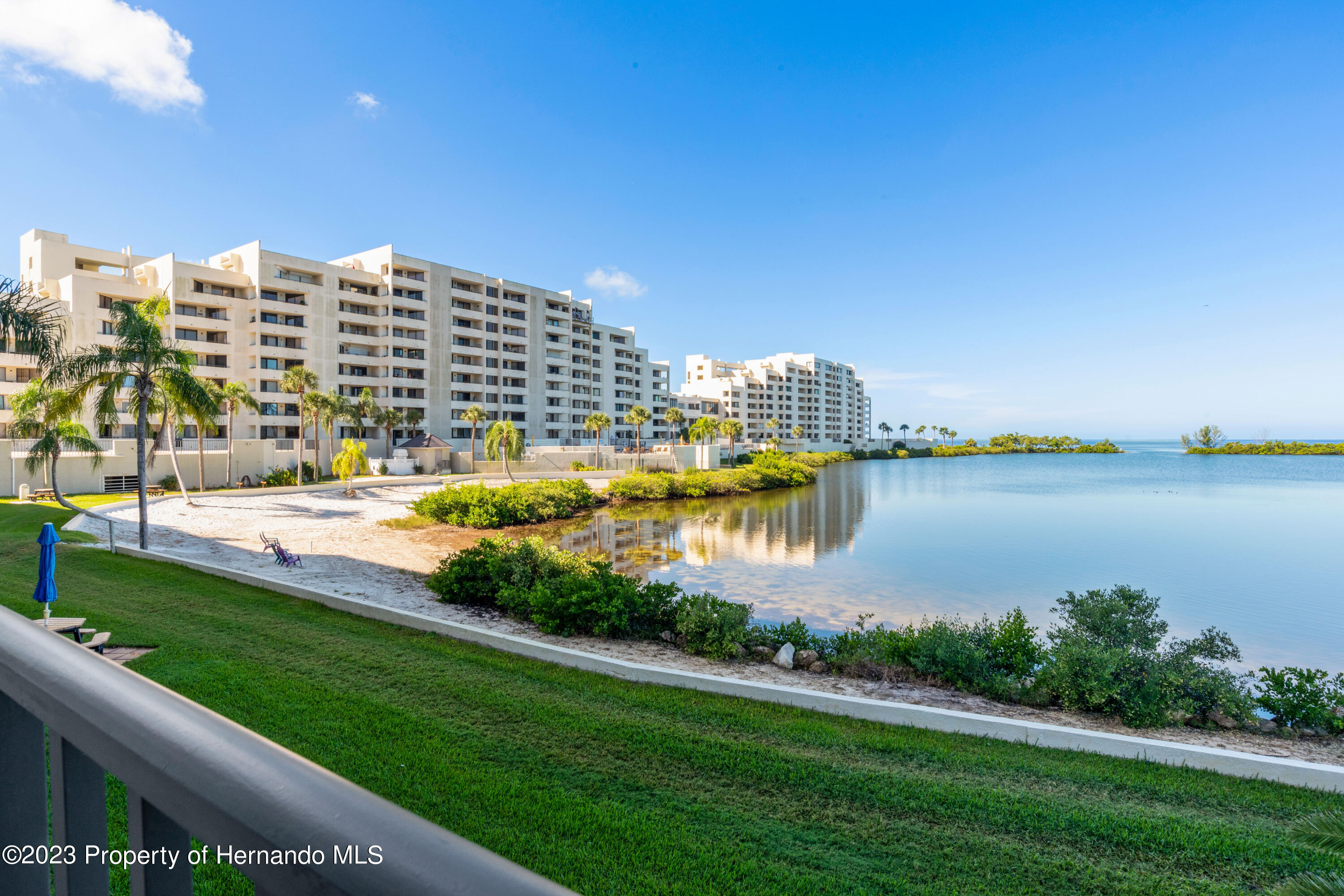 6035 Sea Ranch Drive Hudson, FL 34667 - Photo 1 of 32 a view of a city with tall buildings and a big yard