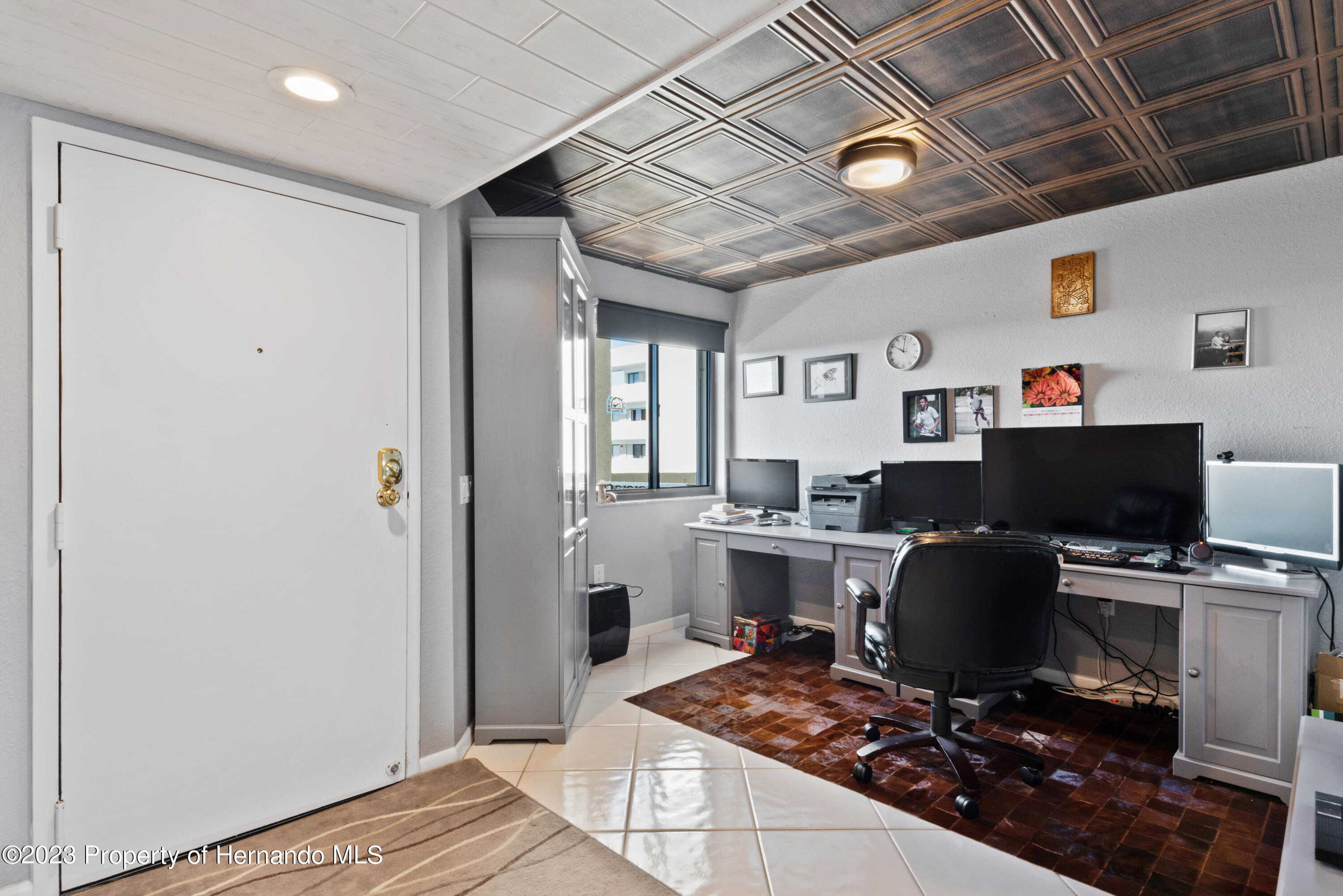 6035 Sea Ranch Drive Hudson, FL 34667 - Photo 2 of 32 a workspace with furniture and wooden floor