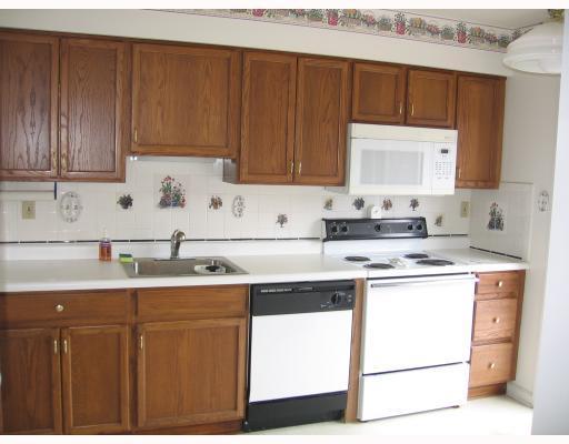 275 Randy Lane Coraopolis, PA 15108 - Photo 2 of 5 Kitchen. New Laminate Floor to be installed. Slider opens to deck with view of Ohio River.
