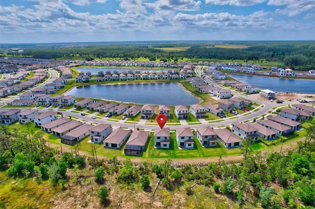 an aerial view of residential house with outdoor space