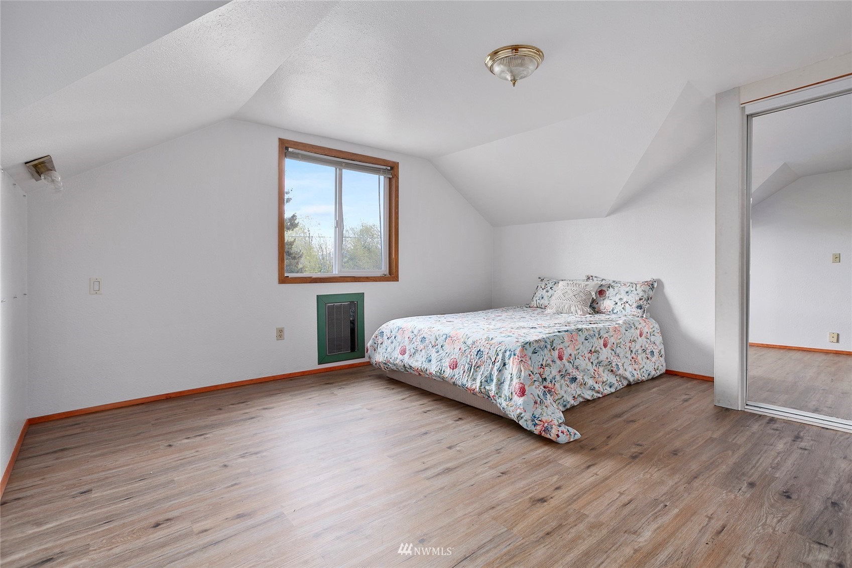 5191 Wickersham Road Acme, WA 98220 - Photo 13 of 23 a bedroom with a bed wooden floor and window