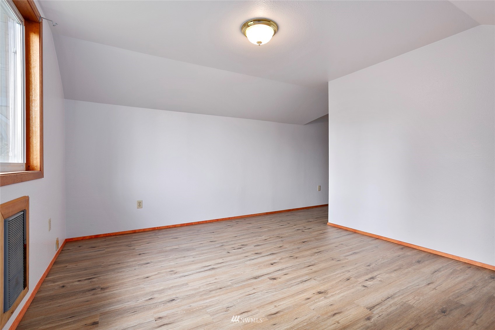 5191 Wickersham Road Acme, WA 98220 - Photo 16 of 23 a view of an empty room with wooden floor and a window