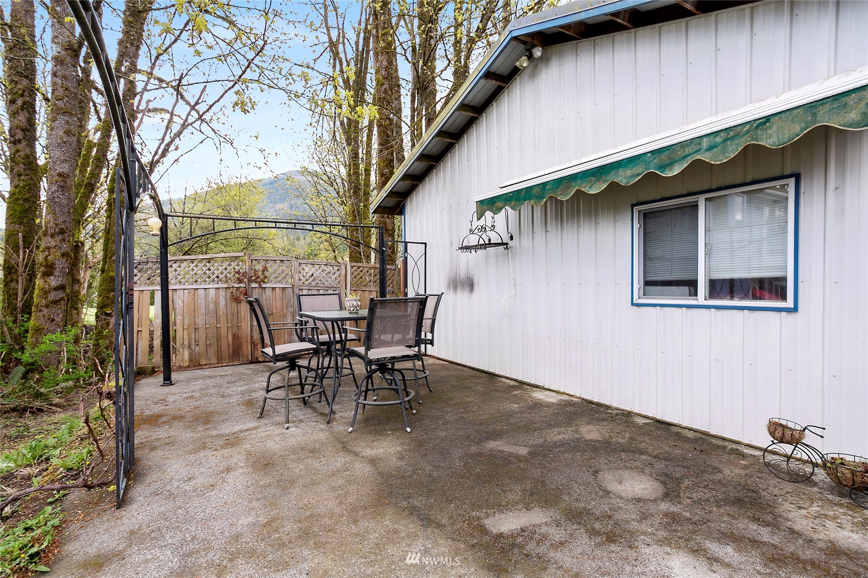 5191 Wickersham Road Acme, WA 98220 - Photo 19 of 23 a backyard of a house with table and chairs