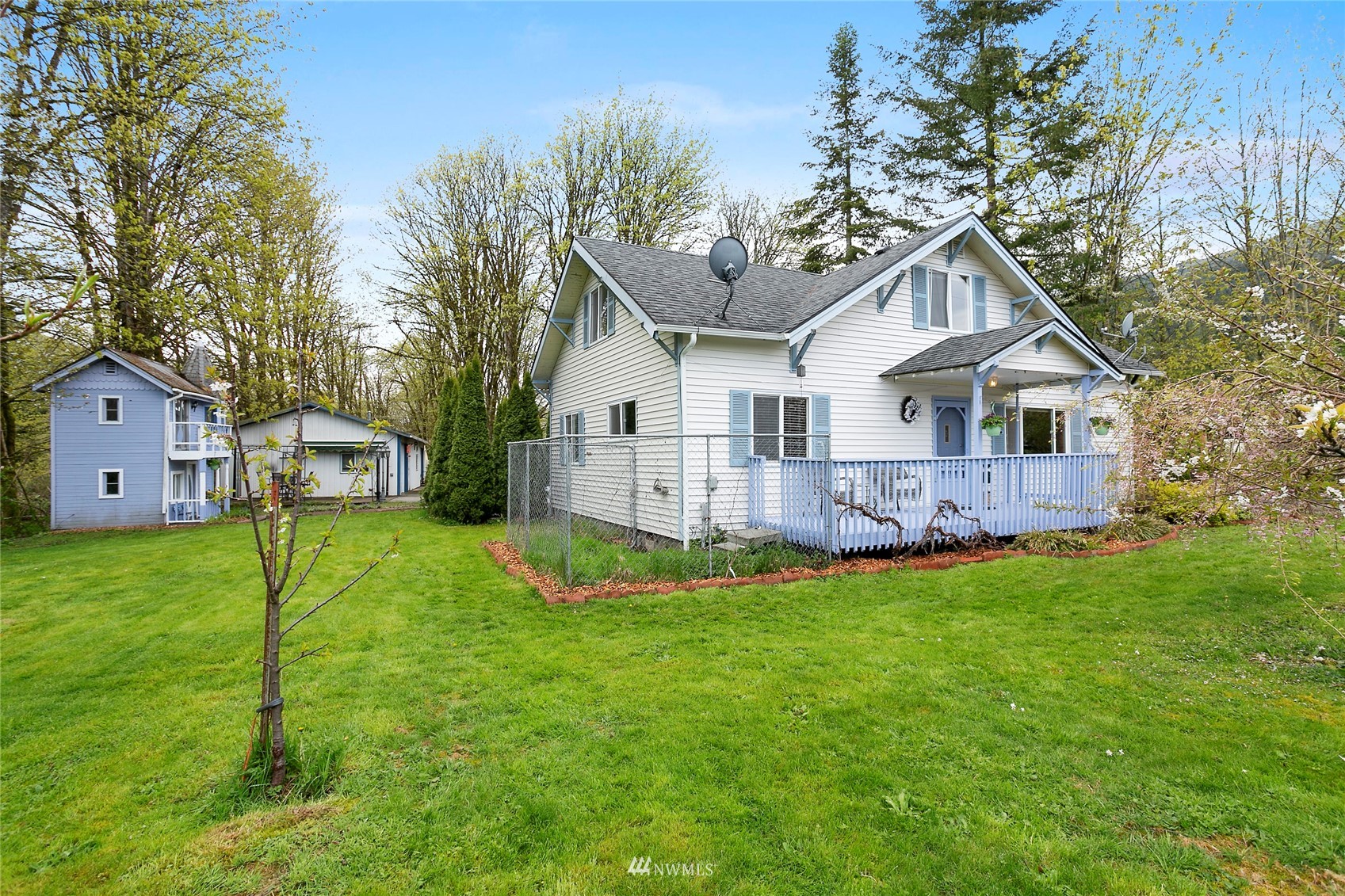 5191 Wickersham Road Acme, WA 98220 - Photo 2 of 23 a front view of a house with a yard and trees