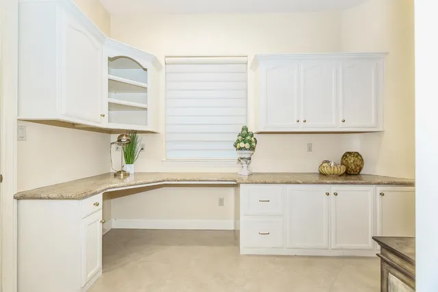 a spacious bedroom with a bed and furniture