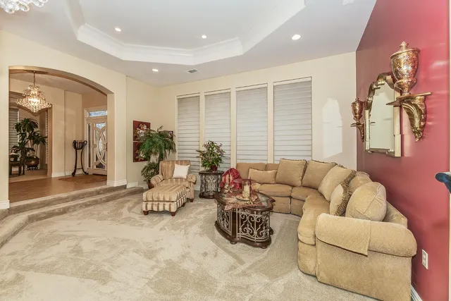 a living room with furniture and a window