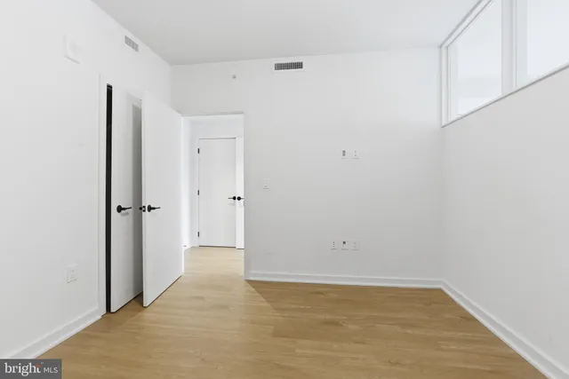a kitchen with stainless steel appliances a refrigerator sink and cabinets