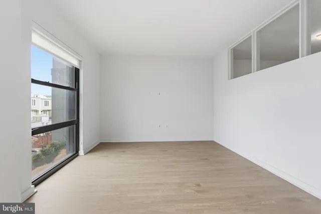 a view of a kitchen with a sink and a fireplace