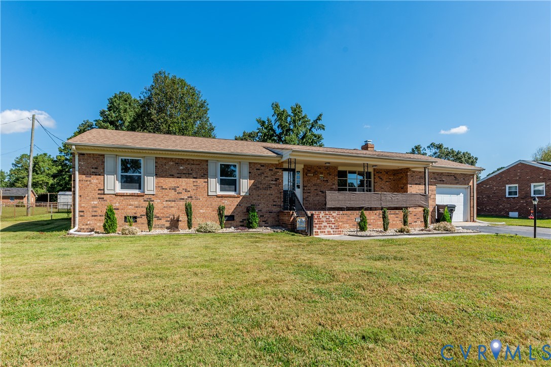 a view of a house with a yard patio and a patio